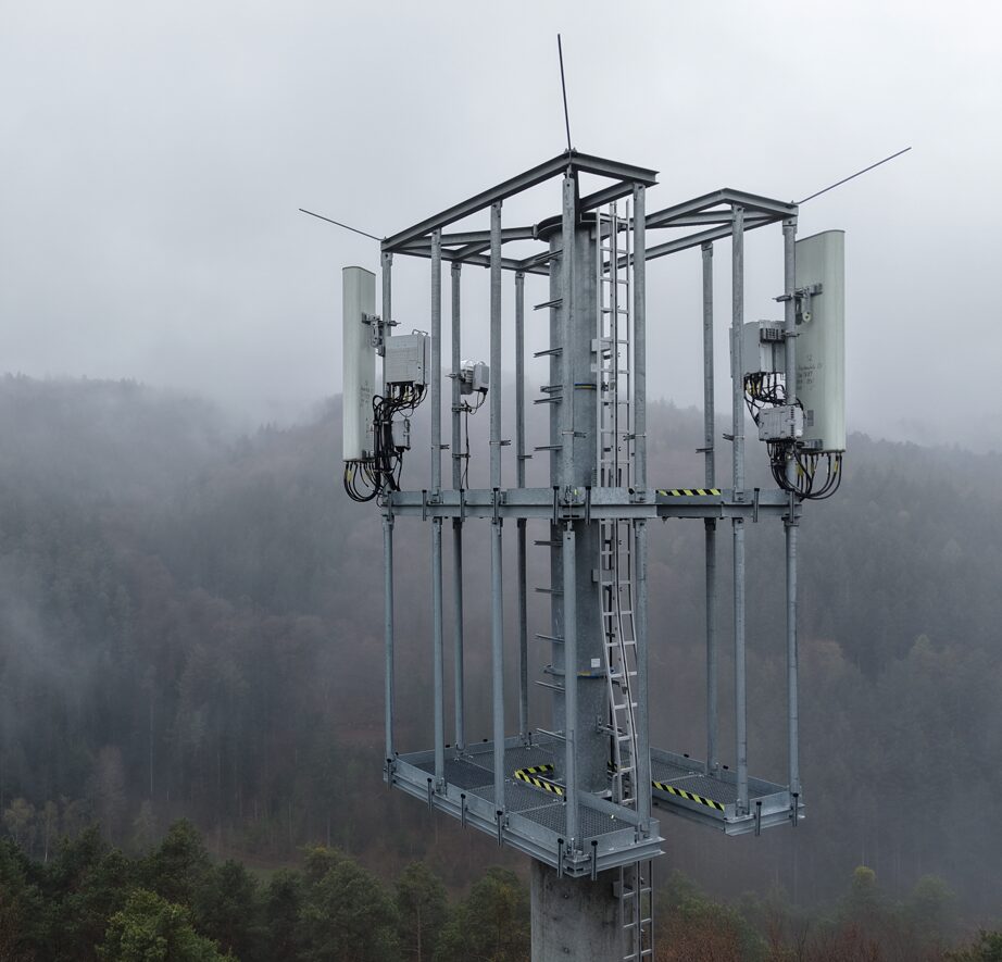 Telecom tower top in fog