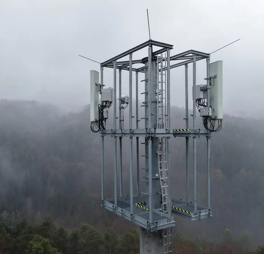 Telecom tower top in fog